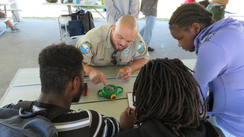 Park ranger leading a program for young visitors at a Florida state park